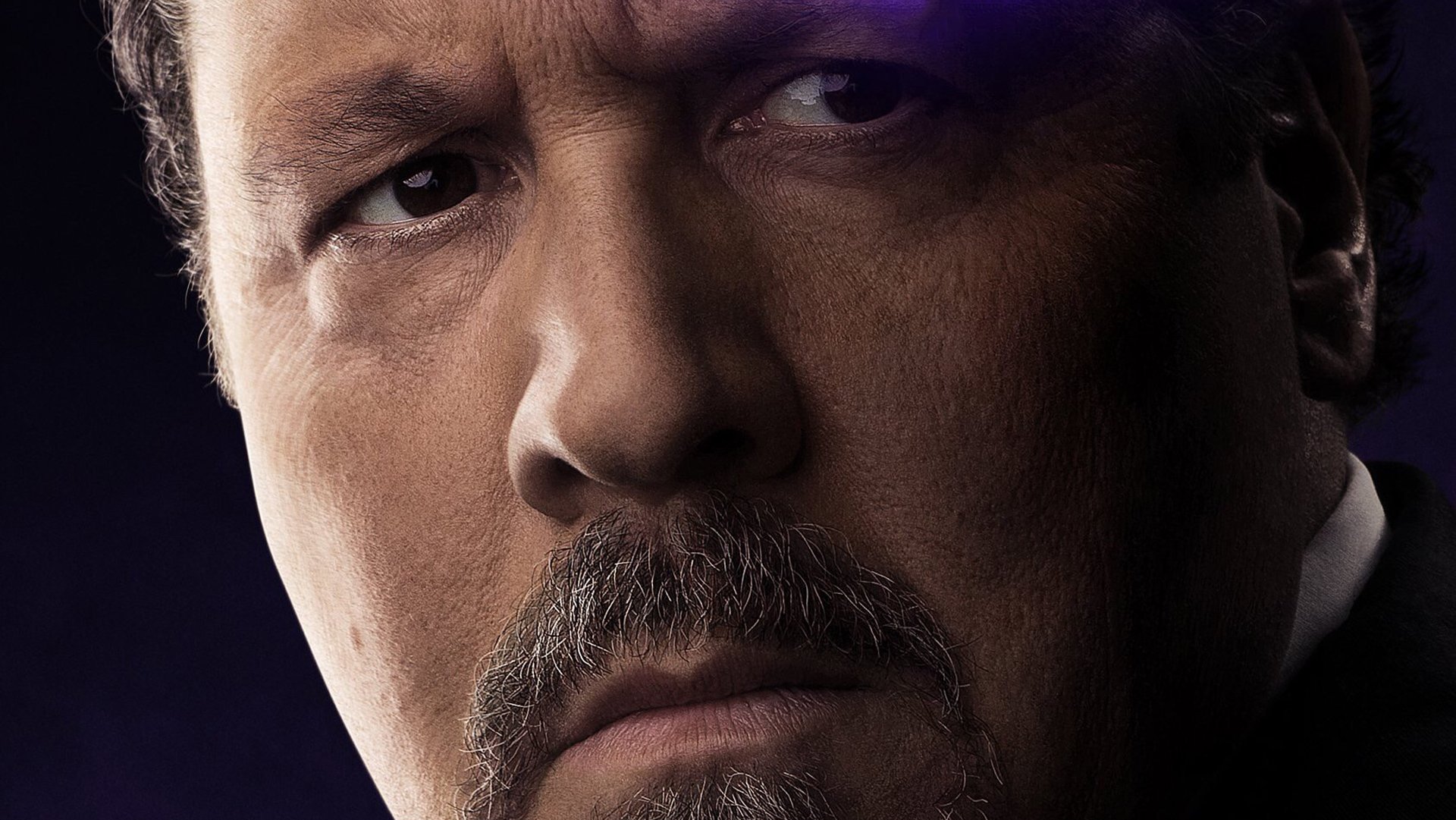 Close-up HD desktop wallpaper of Jon Favreau as Happy Hogan from the movie Avengers: Endgame, capturing his serious and intense expression.