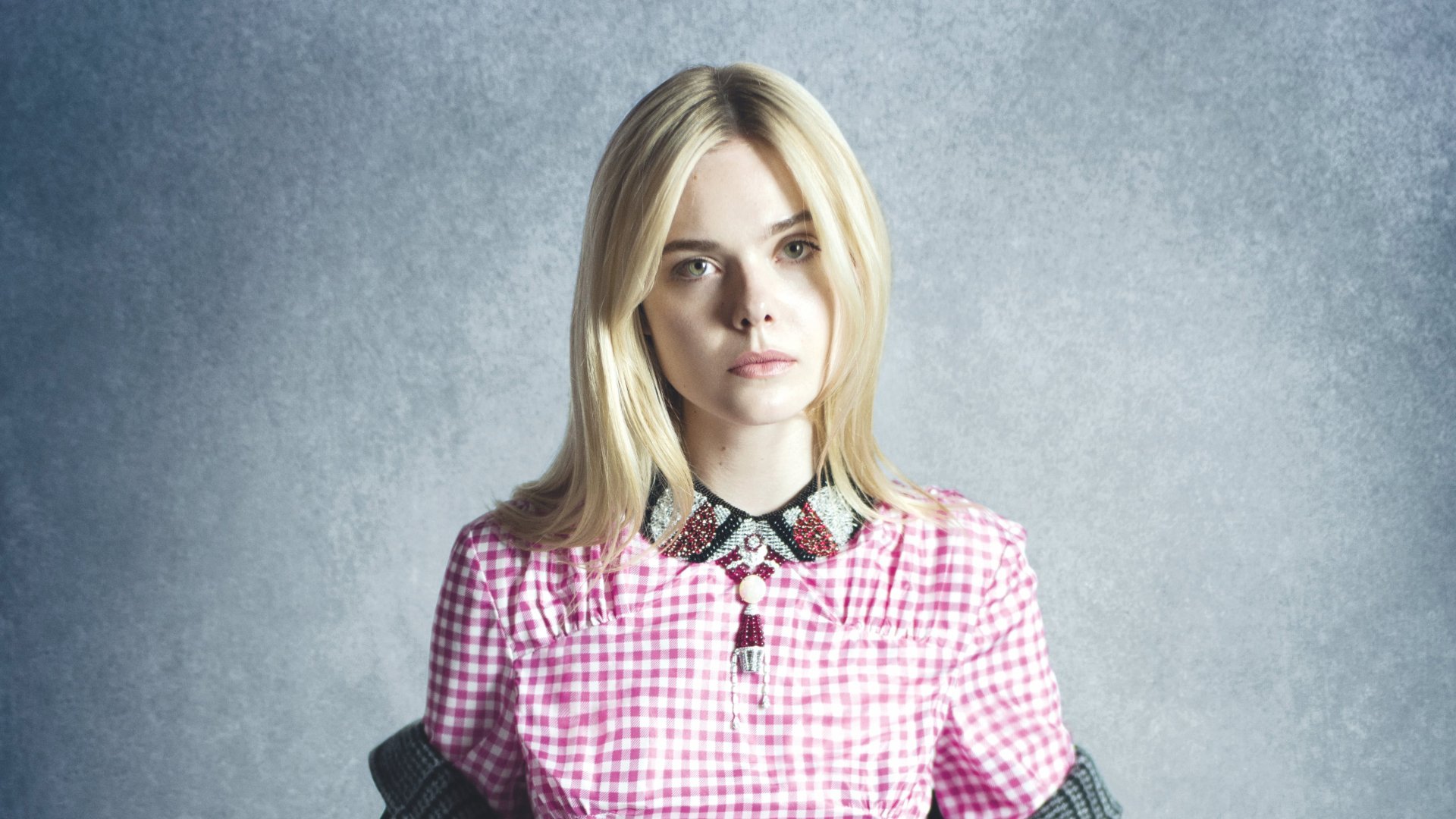 Portrait of blonde celebrity Elle Fanning in a pink checkered dress with a black collar, captured in high-resolution 4K Ultra HD for PC desktop wallpaper.