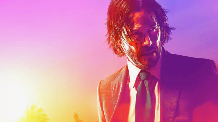 HD desktop wallpaper featuring Keanu Reeves as John Wick in 'John Wick: Chapter 3 - Parabellum' with a vibrant sunset background.