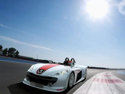 2006 Peugeot Spider Concept race car — white-and-red open-top roadster speeding on a racetrack; HD PC desktop wallpaper background.