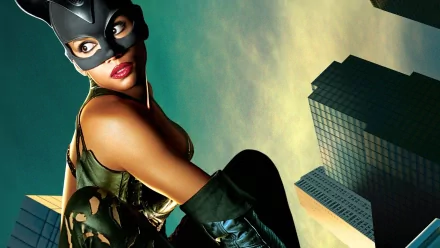A striking HD desktop wallpaper featuring Catwoman poised atop a skyline, showcasing her iconic costume and fierce expression against a vibrant sky.