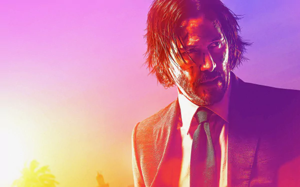 HD desktop wallpaper featuring Keanu Reeves as John Wick in 'John Wick: Chapter 3 - Parabellum' with a vibrant sunset background.