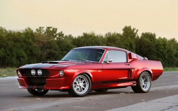 A red Ford Mustang GT classic muscle car with black racing stripes parked on a road, captured in an HD desktop wallpaper featuring the Ford Mustang Shelby GT500.