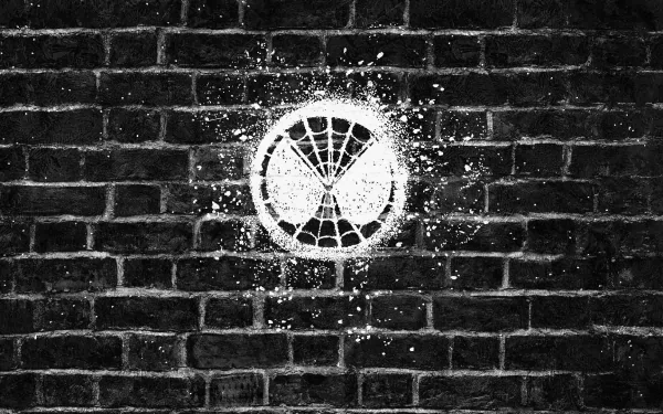 HD PC desktop wallpaper featuring a white Spider-Man mask emblem spray-painted on a dark brick wall, inspired by the movie Spider-Man: Far From Home.