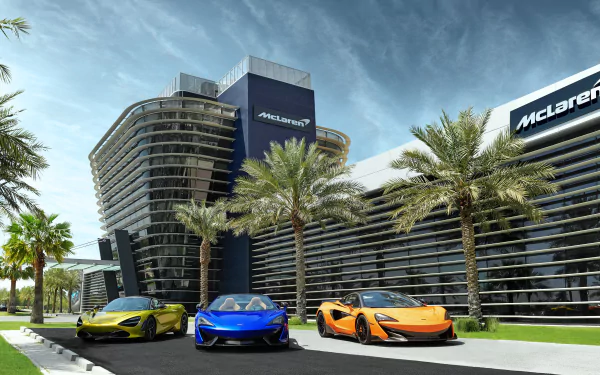 A 4K Ultra HD wallpaper featuring McLaren 600LT, 720S, and 570S supercars in orange, blue, and green parked in front of a McLaren building lined with palm trees.