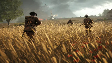 HD PC wallpaper featuring a World War I battlefield scene from the video game Battlefield 1, showing soldiers advancing through a wheat field toward a distant windmill.