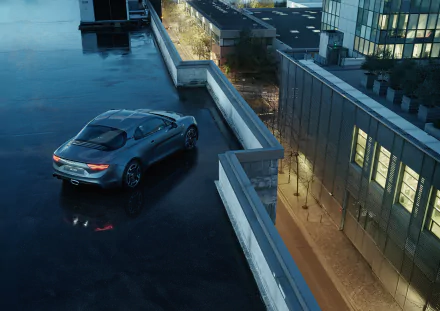 Silver Alpine A110 car parked on a rooftop at dusk, captured in high definition for a sleek PC desktop wallpaper and background.