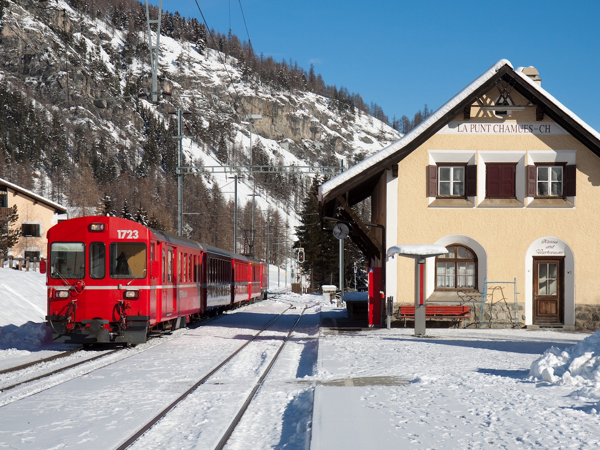 Scenic capture of Rhaetian Railway winding through picturesque landscapes