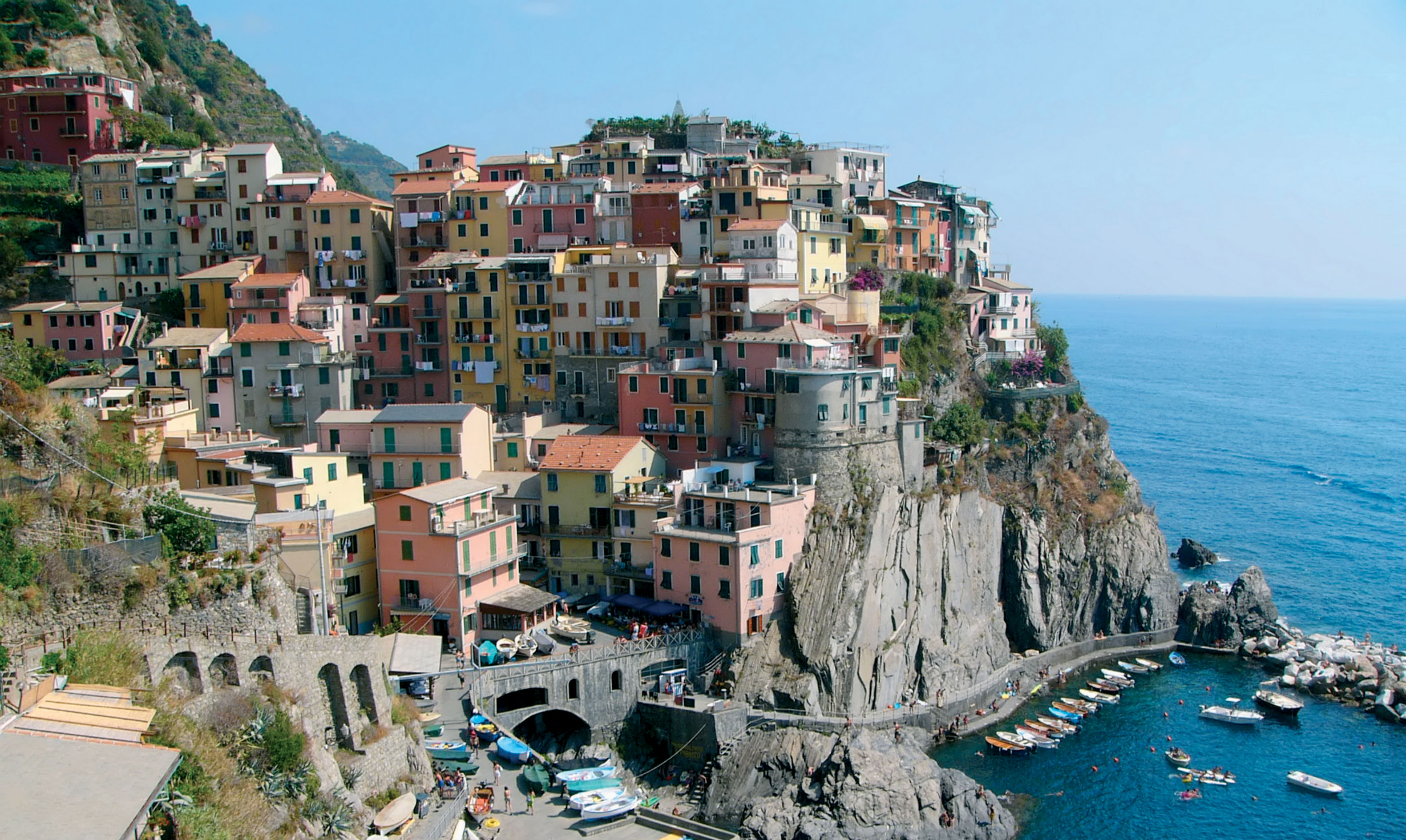 Cinque Terre, Italy - stunning coastal view with colorful buildings nestled in the cliffs.