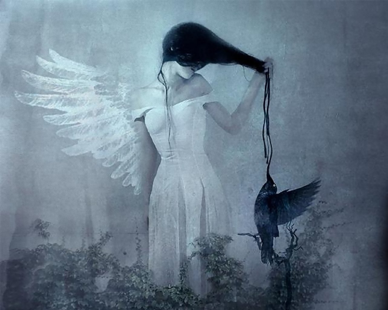 A mystical woman with angel wings stands against a haunting backdrop, holding a black crow by a string, embodying a blend of fantasy and ethereal beauty in this HD wallpaper.