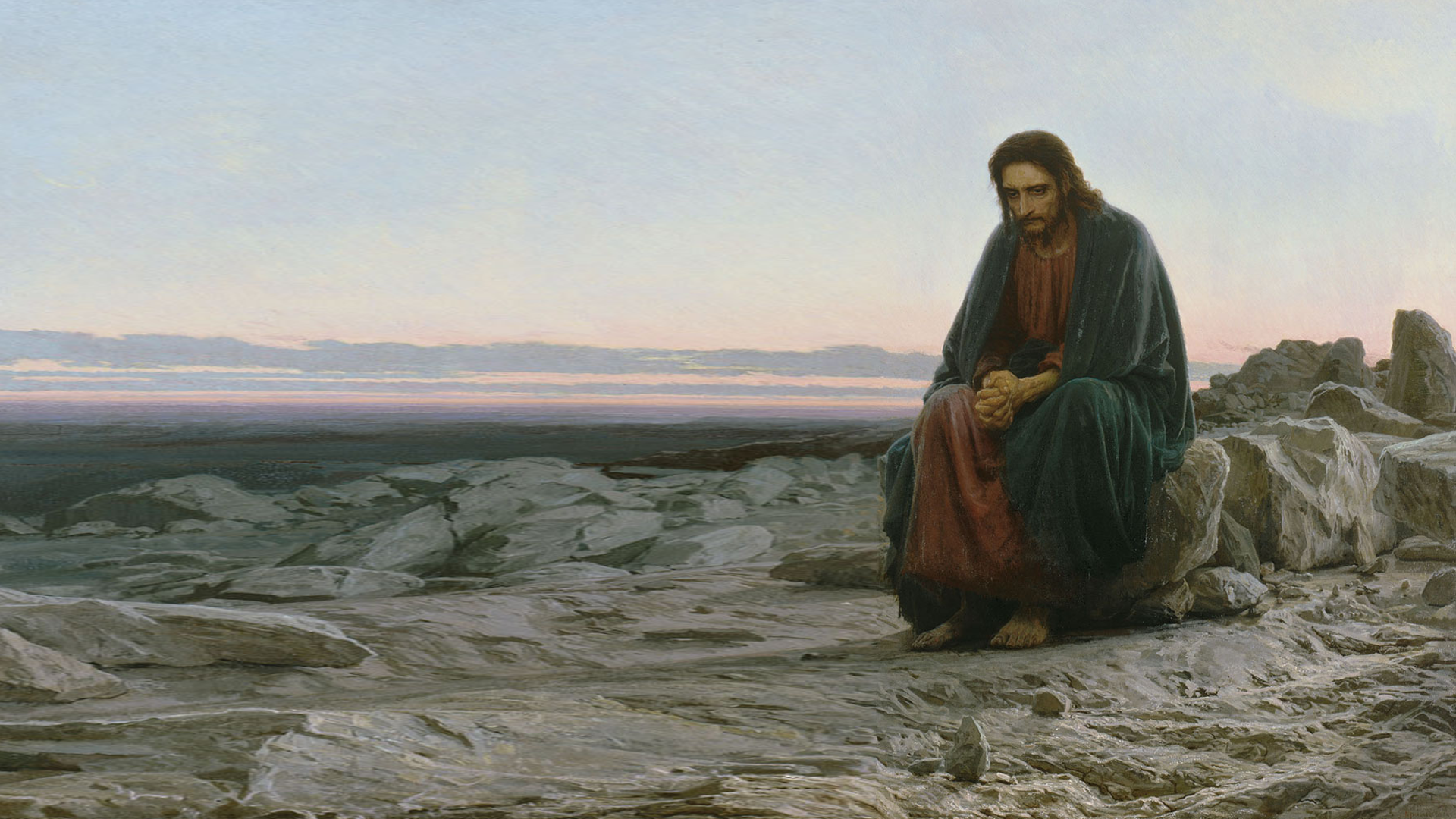 HD desktop wallpaper depicting a serene religious scene of Jesus sitting thoughtfully on rocky terrain at dawn.