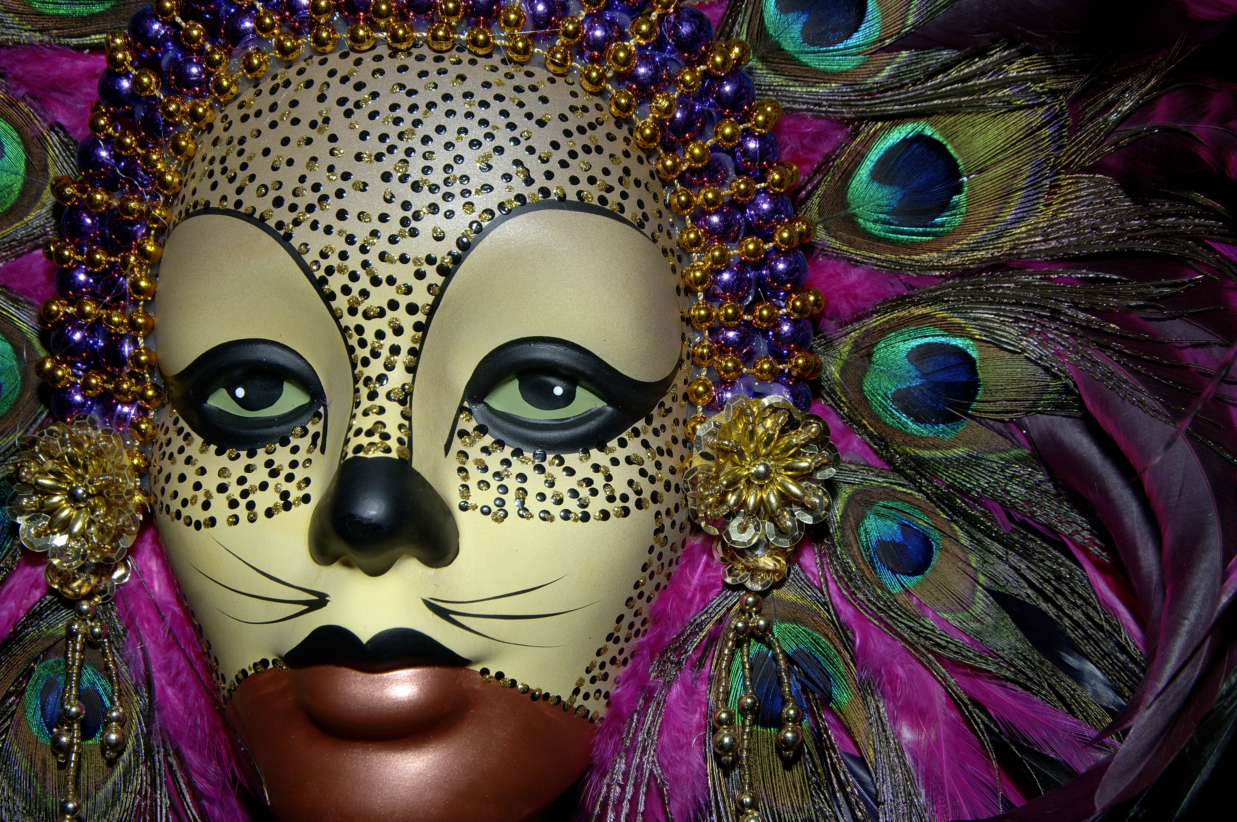 Photograph of a mask with 4K ultra HD desktop wallpaper.