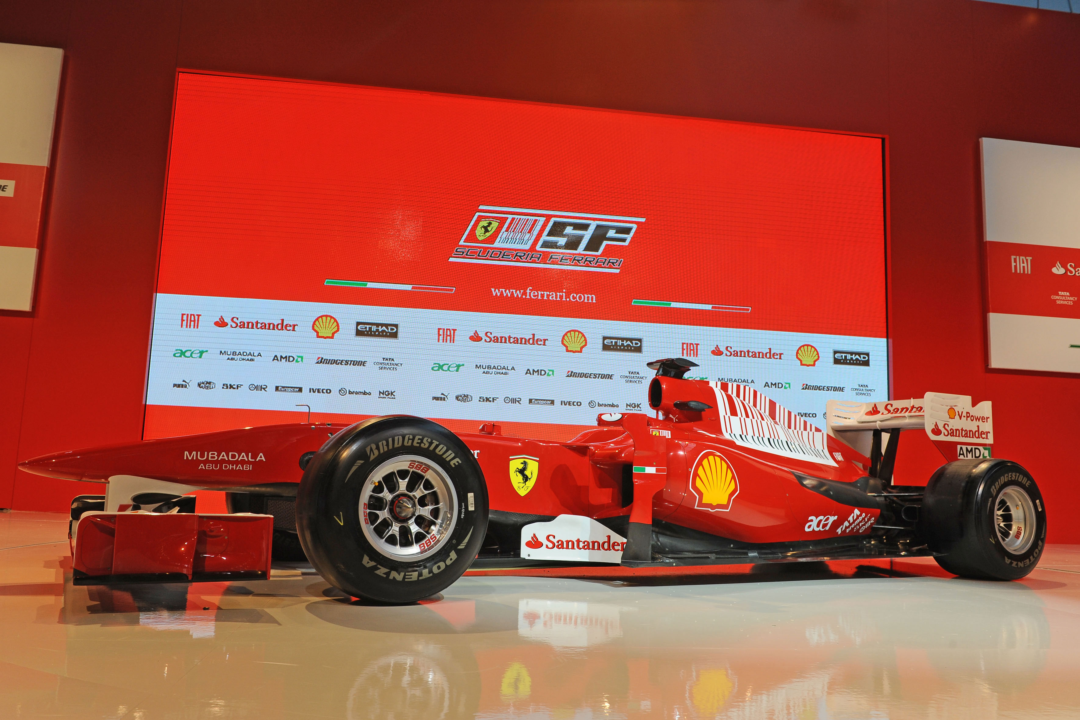 Ferrari F10 racing car on a sports track
