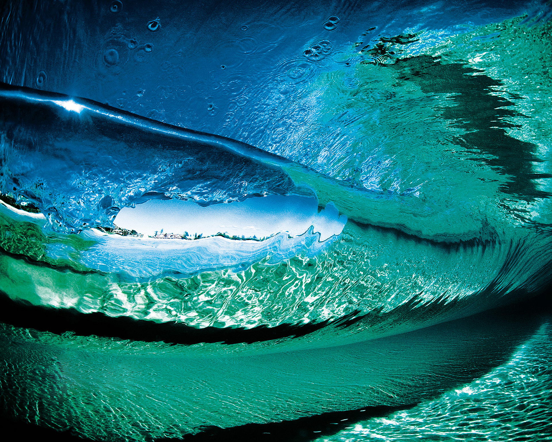 Nature's majestic power on display: an ocean wave crashing against the shore.