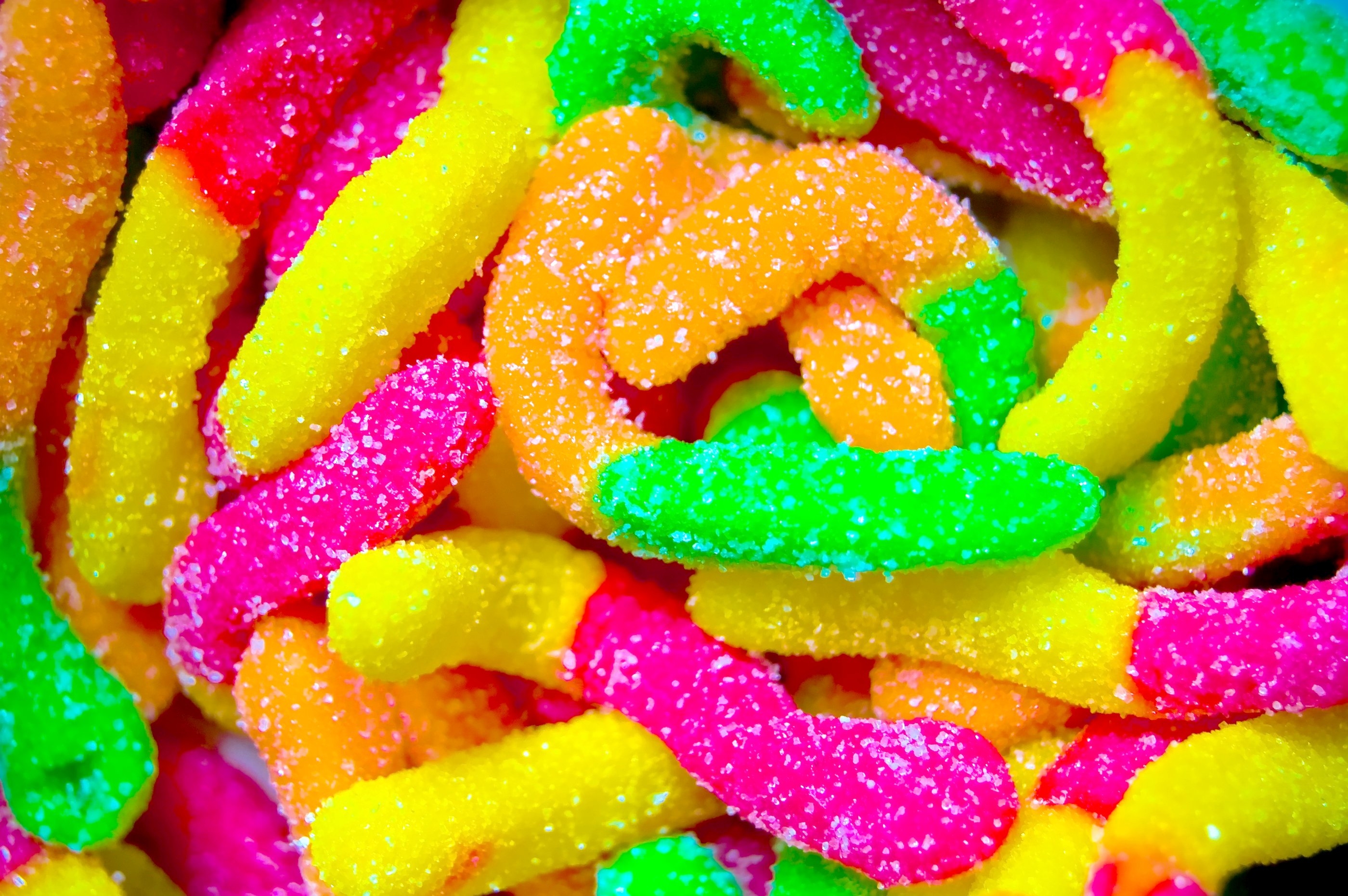 Delicious assortment of colorful candies on a desktop wallpaper.