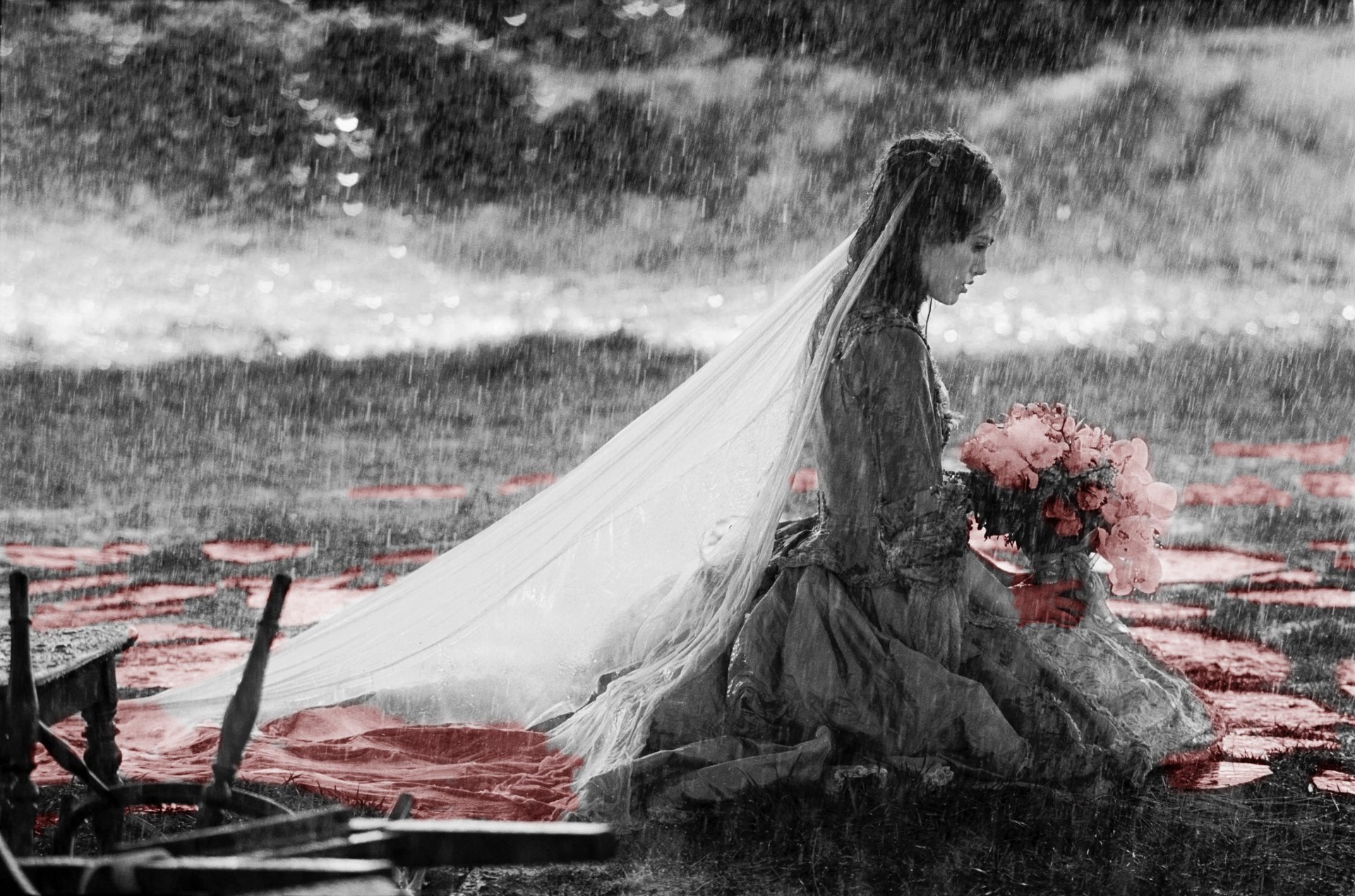 Artistic HD desktop wallpaper featuring a woman in a Pirates of the Caribbean-inspired setting, sitting with a bouquet amidst a rainy, dramatic background.