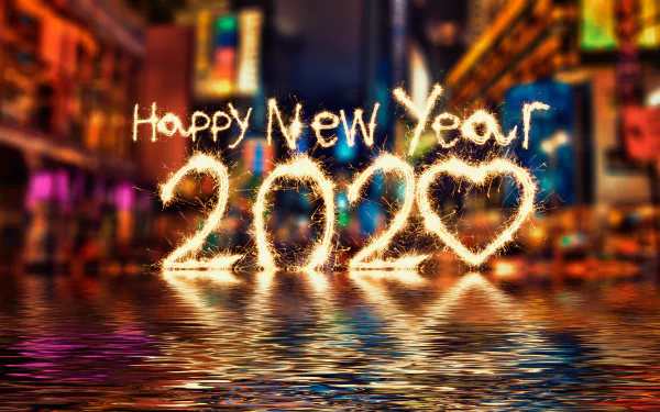4K Ultra HD New Year 2020 desktop wallpaper featuring sparkling Happy New Year 2020 text with a heart, set against a vibrant holiday cityscape background.