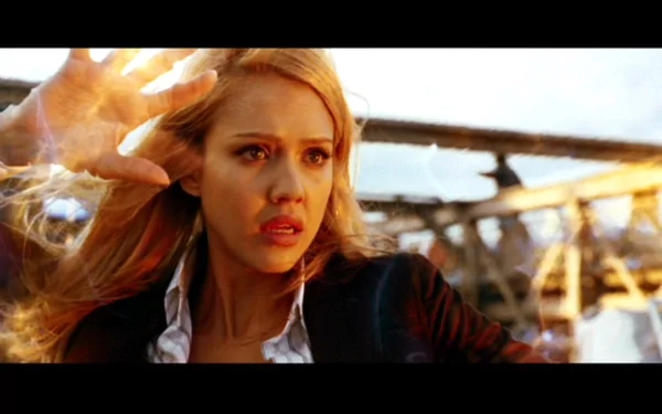 High-definition wallpaper from the movie Fantastic Four, featuring a woman with blonde hair, expressing intense emotion against a dramatic backdrop.
