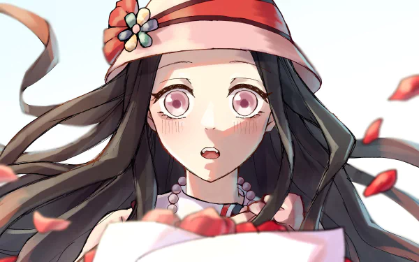 An HD wallpaper featuring Nezuko Kamado from the anime Demon Slayer: Kimetsu no Yaiba, showcasing her expressive face surrounded by swirling petals.