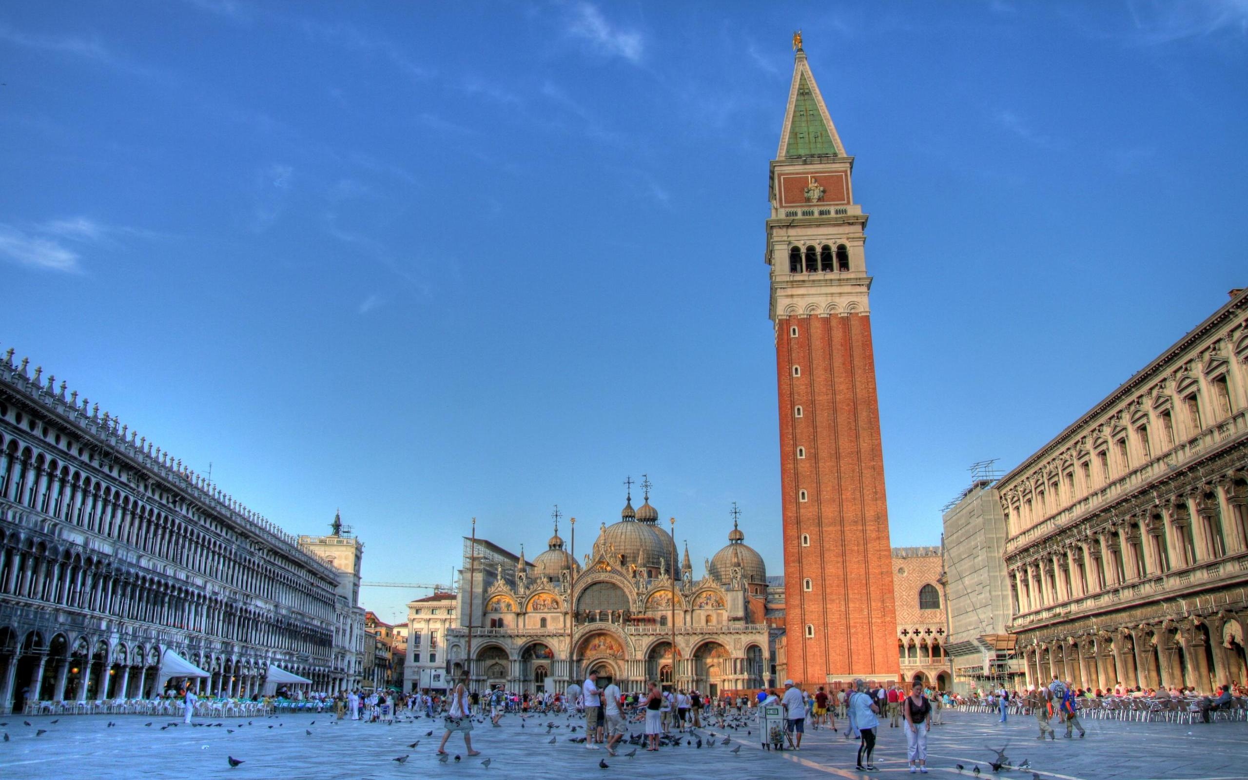 Venice's St. Marco Plaza in Italy, a majestic building amidst a scenic setting.
