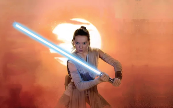 Rey from Star Wars: The Rise of Skywalker wielding a glowing blue lightsaber against a fiery orange background in this 4K Ultra HD movie-themed desktop wallpaper.