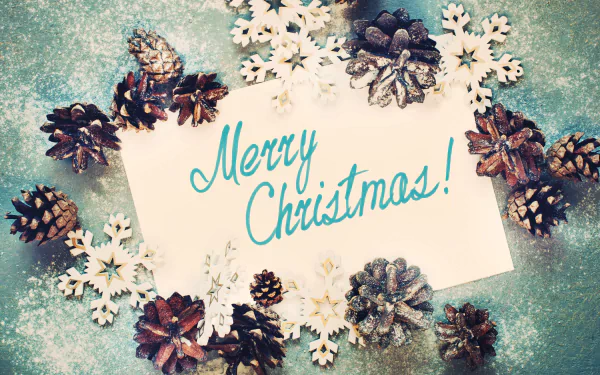 4K Ultra HD Christmas desktop wallpaper featuring a Merry Christmas! card surrounded by pine cones and white snowflake decorations on a textured background.