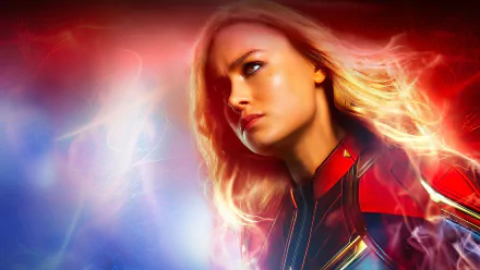 HD PC desktop wallpaper featuring Brie Larson as Carol Danvers from the Captain Marvel movie, with vibrant red and blue glowing effects.