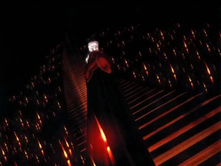 Dark, atmospheric HD anime wallpaper featuring Vampire Hunter D standing amidst glowing red lights and shadows, highlighting a gothic vampire theme.