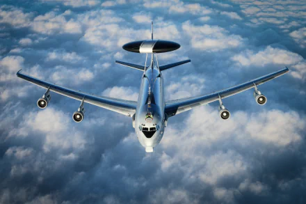 A Boeing E-3 Sentry military aircraft flies above a blanket of clouds, captured in stunning 4K Ultra HD for a striking desktop wallpaper background.