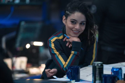 Vanessa Hudgens, American actress with black hair, smiling in a scene from the movie Bad Boys for Life, featured in a 4K Ultra HD desktop wallpaper.