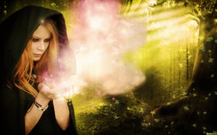 A fantasy-themed HD wallpaper featuring a witch in a hood, casting magical sparkles in a mystical forest with beams of light filtering through the trees.