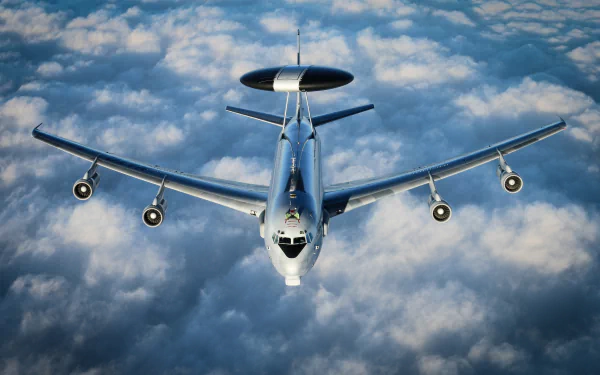 A Boeing E-3 Sentry military aircraft flies above a blanket of clouds, captured in stunning 4K Ultra HD for a striking desktop wallpaper background.
