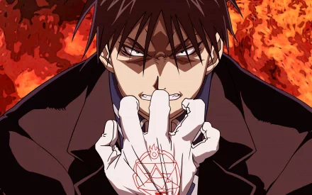 Roy Mustang from *Fullmetal Alchemist* stands confidently amidst flames, showcasing his powerful alchemical skills with a dramatic expression, making a striking HD desktop wallpaper.