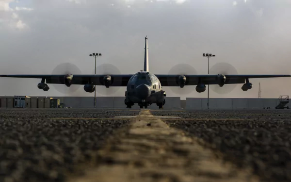 Front view of a Lockheed MC-130 military transport aircraft on runway under a cloudy sky, captured in 4K Ultra HD for a PC desktop wallpaper.