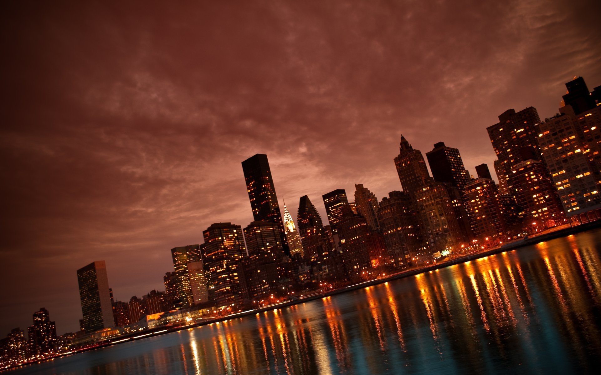 Manhattan skyline with cityscape at night in New York.