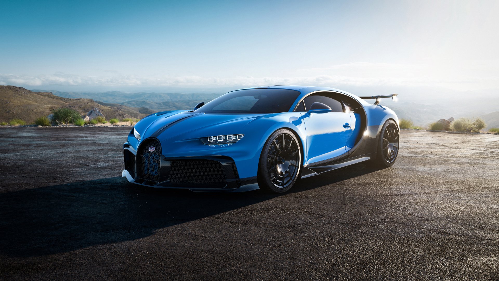 Blue Bugatti Chiron Pur Sport supercar on a sunlit coastal road, captured as a 5K Ultra HD PC desktop wallpaper background.