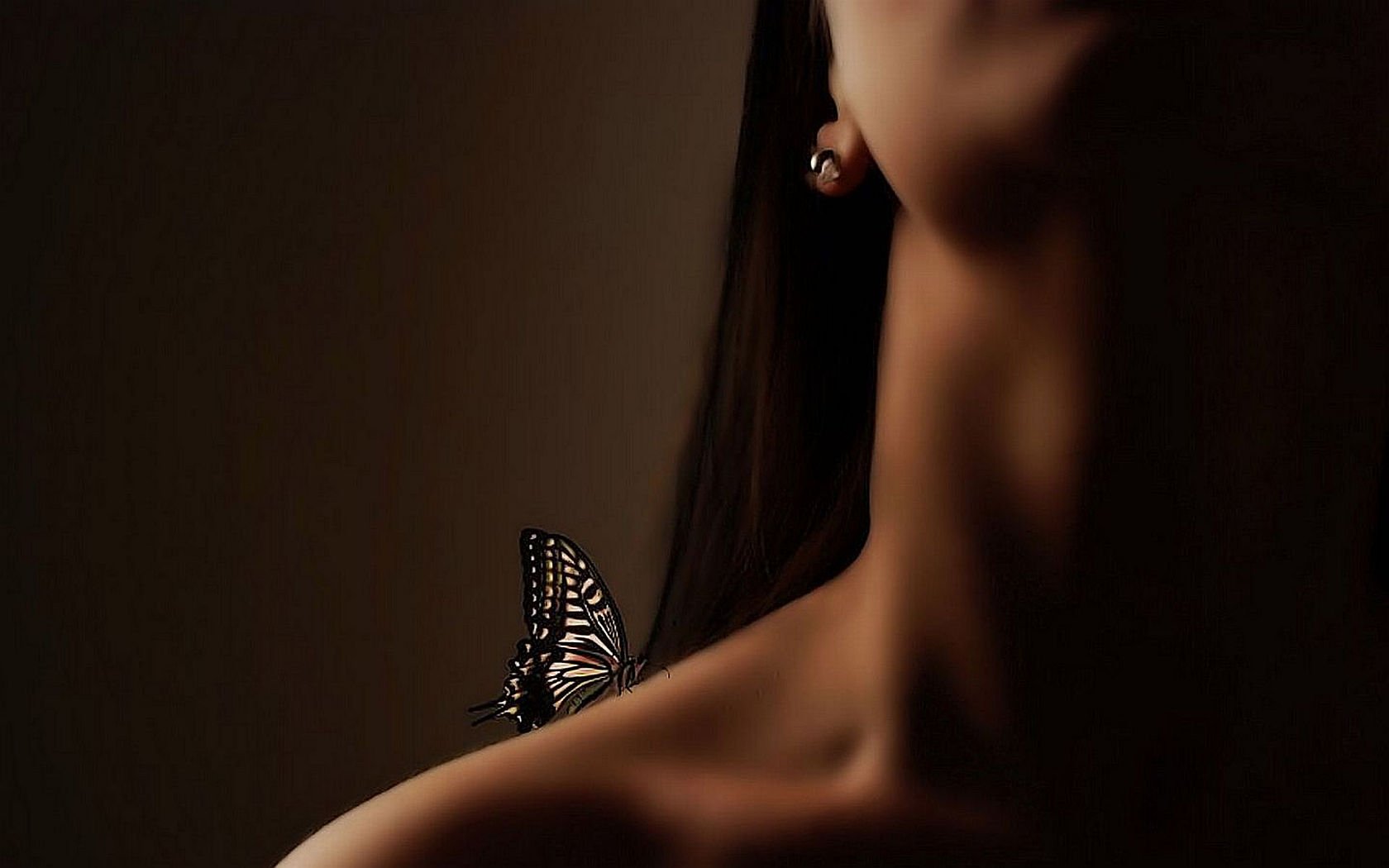 Artistic HD wallpaper featuring a close-up of a woman's neck and shoulder with a butterfly perched delicately, evoking a sense of intimacy and natural beauty.