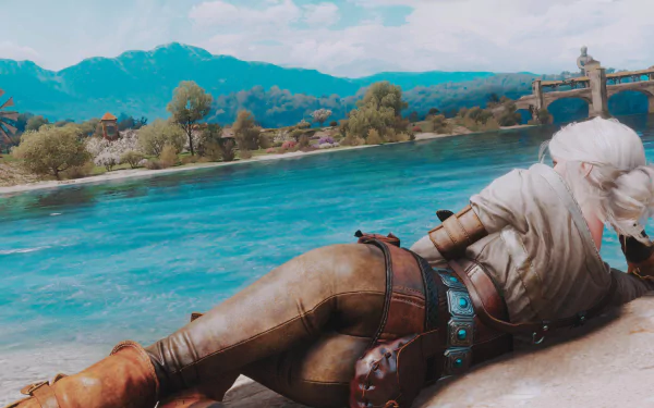 Ciri from The Witcher 3: Wild Hunt lounges by a serene riverside in this HD PC desktop wallpaper from the video game.