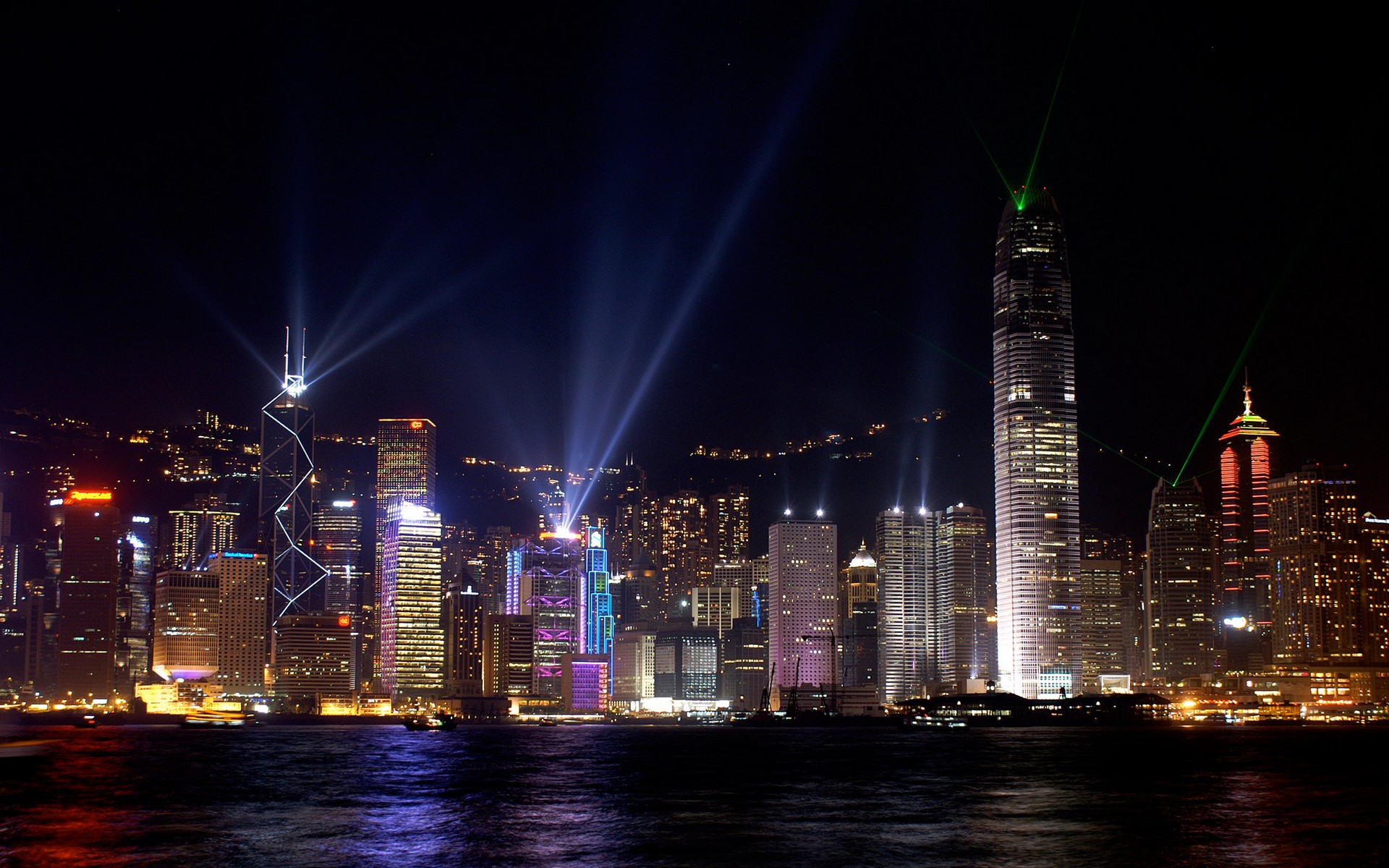 Night skyline of Hong Kong with illuminated buildings and city lights