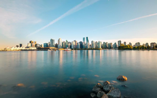 4K Ultra HD view of Brisbane's man-made skyline reflecting on calm waters under a clear sky in Australia.