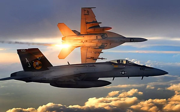 Two Boeing F/A-18E/F Super Hornet jets soar through a colorful sky, showcasing their agility and design in this striking HD desktop wallpaper.
