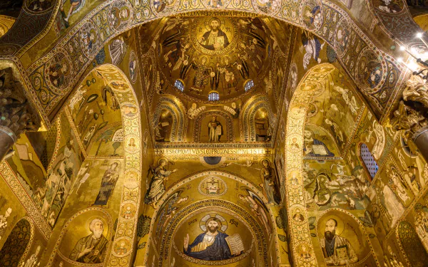 Golden mosaic interior of the Palatine Chapel in Palermo, Sicily, Italy — ornate religious church arches, domes and icons. 2K Quad HD PC desktop wallpaper/background.