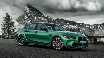 Green BMW M3 Competition parked on alpine roadside under dramatic clouds, 4K Ultra HD PC desktop wallpaper of a high-performance BMW vehicle.