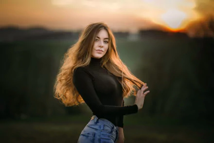 Portrait of a redhead woman model wearing makeup and jeans, set against a blurred outdoor background at sunset, captured in HD for a PC desktop wallpaper.