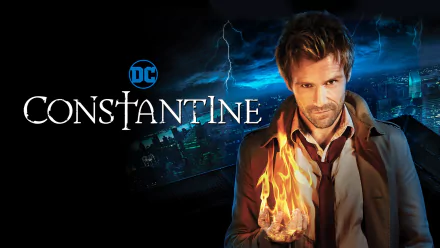 John Constantine (DC Comics) from the Constantine TV show, trench coat and a burning hand over a stormy city skyline — HD PC desktop wallpaper.