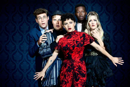 A striking HD desktop wallpaper from the TV show Search Party, featuring the main characters in dramatic poses against a deep blue backdrop.