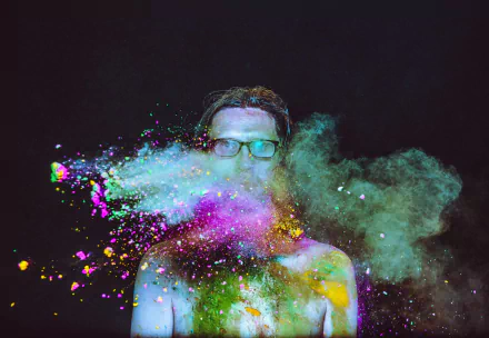 HD desktop wallpaper featuring an artistic representation with vibrant color splashes against a dark background.