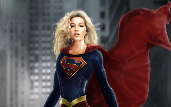 4K Ultra HD PC desktop wallpaper featuring Kara Zor-El as Supergirl from DC Comics, standing confidently with a flowing red cape against a blurred cityscape background.