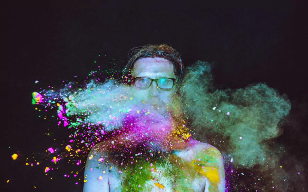 HD desktop wallpaper featuring an artistic representation with vibrant color splashes against a dark background.