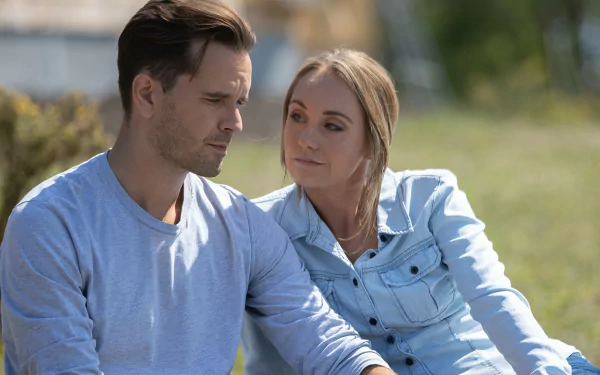 HD desktop wallpaper featuring two characters from Heartland in a contemplative moment.